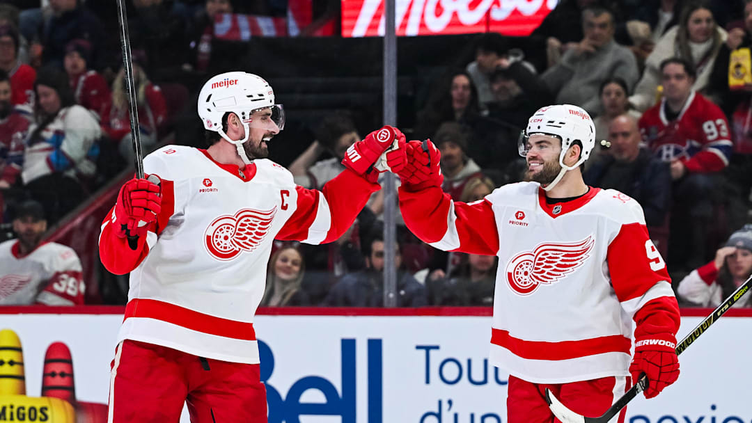 Jan 10, 2026; Montreal, Quebec, CAN; Detroit Red Wings center Dylan Larkin (71) celebrates with right wing Alex DeBrincat (93) his goal against the Montreal Canadiens during the second period at Bell Centre. Mandatory Credit: David Kirouac-Imagn Images