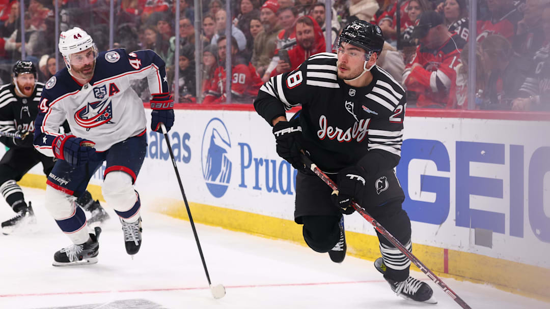 Feb 3, 2026; Newark, New Jersey, USA; New Jersey Devils right wing Timo Meier (28) skates with the puck as Columbus Blue Jackets defenseman Erik Gudbranson (44) defends during the second period at Prudential Center. Mandatory Credit: Ed Mulholland-Imagn Images