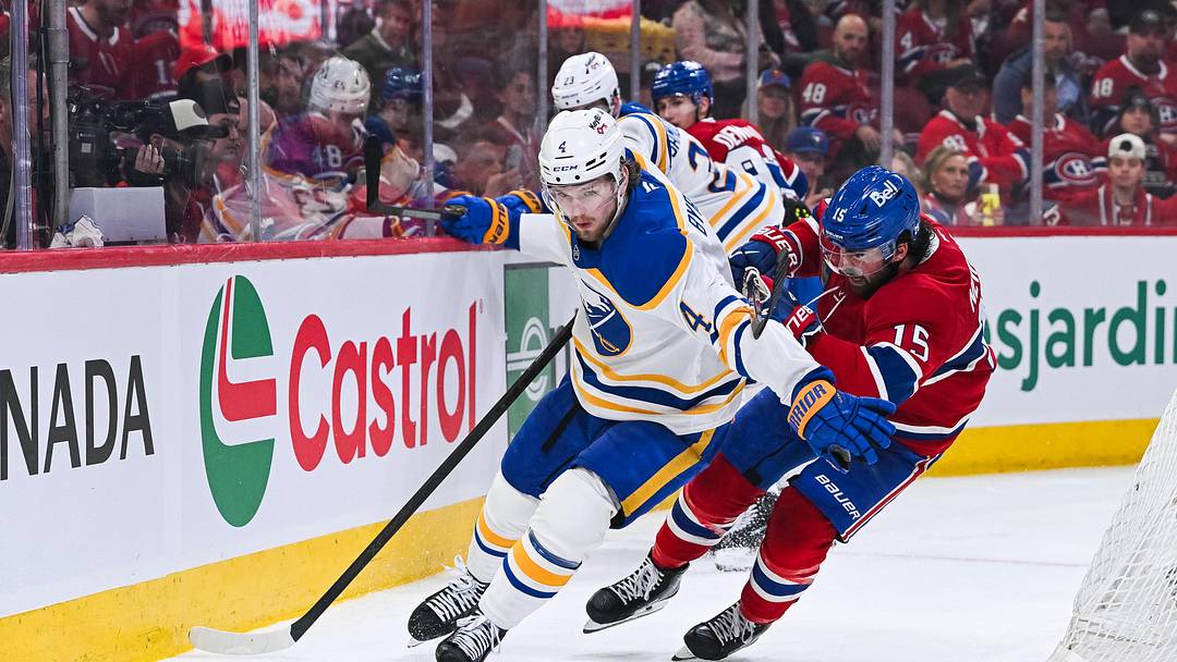May 16, 2026; Montreal, Quebec, CAN; Buffalo Sabres defenseman Bowen Byram (4) defends the puck against Montreal Canadiens center Alex Newhook (15) during the third period in game six of the second round of the 2026 Stanley Cup Playoffs at Bell Centre. Mandatory Credit: David Kirouac-Imagn Images