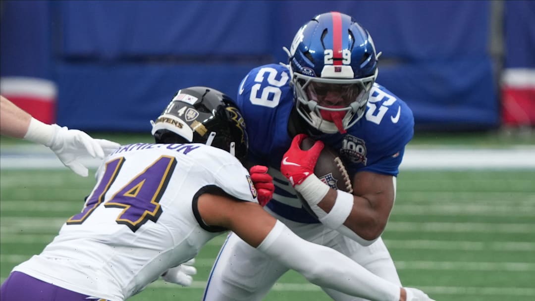 East Rutherford, NJ -- December 15, 2024 -- Kyle Hamilton of the Ravens and Tyrone Tracy Jr. of the Giants in the first half. The Baltimore Ravens came to MetLife Stadium to play the New York Giants.