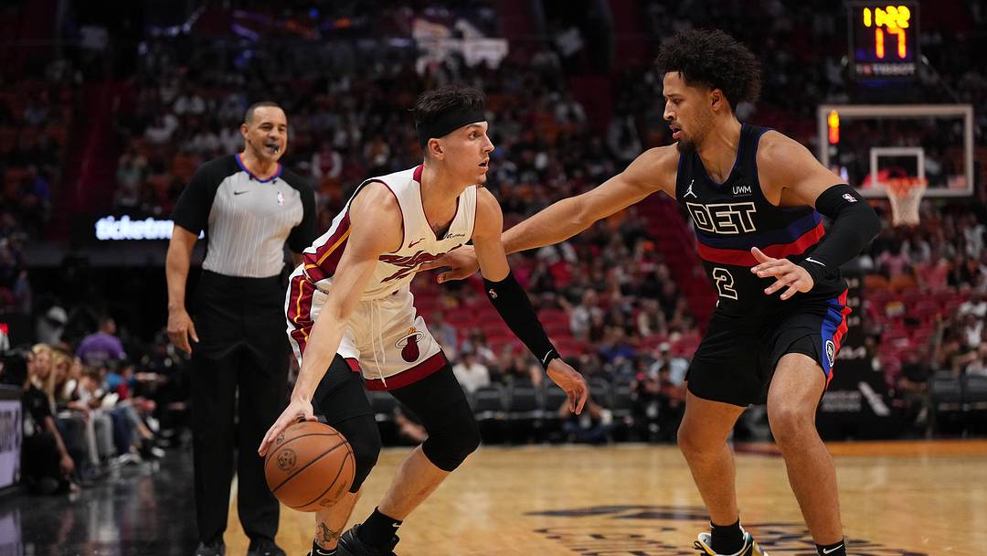 Oct 25, 2023; Miami, Florida, USA; Miami Heat guard Tyler Herro (14) drives the ball around Detroit Pistons guard Cade Cunningham (2) during the first second half at Kaseya Center. Mandatory Credit: Jasen Vinlove-Imagn Images