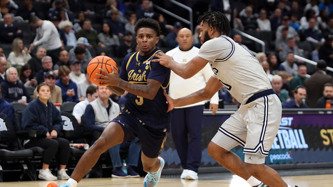 Nov 16, 2024; Washington, District of Columbia, USA; Notre Dame Fighting Irish guard Markus Burton (3) drives past Georgetown Hoyas guard Jayden Epps (10) during the second half at Capital One Arena. Mandatory Credit: Daniel Kucin Jr.-Imagn Images