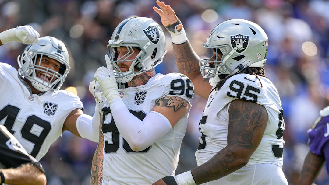 Sep 15, 2024; Baltimore, Maryland, USA; Las Vegas Raiders defensive end Maxx Crosby (98) celebrates with defensive end Charles Snowden (49) and defensive tackle John Jenkins (95) after sacking Baltimore Ravens quarterback Lamar Jackson (not pictured) during the second half at M&T Bank Stadium. Mandatory Credit: Reggie Hildred-Imagn Images Sep 15, 2024; Baltimore, Maryland, USA; Las Vegas Raiders defensive end Maxx Crosby (98) celebrates with defensive end Charles Snowden (49) and defensive tackle John Jenkins (95) after sacking Baltimore Ravens quarterback Lamar Jackson (not pictured) during the second half at M&T Bank Stadium. Mandatory Credit: Reggie Hildred-Imagn Images