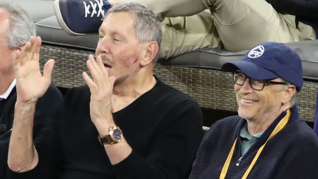 Larry Ellison and Bill Gates react to a point in the Alexander Zverev vs. Gael Monfils match at the BNP Paribas Open 