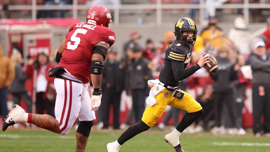 Nov 29, 2025; Fayetteville, Arkansas, USA; Missouri Tigers quarterback Beau Pribula (9) runs during the first quarter against the Arkansas Razorbacks at Donald W. Reynolds Razorback Stadium. Mandatory Credit: Nelson Chenault-Imagn Images