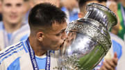 Lautaro Martinez with the Copa America trophy after scoring the game-winning goal against Colombia