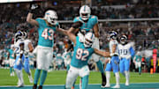 Miami Dolphins defensive tackle Zach Sieler (92) celebrates his touchdown after intercepting a pass from Tennessee Titans quarterback Will Levis during the first half at Hard Rock Stadium in 2023.