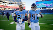Tennessee Titans linebacker Cody Barton (50) and defensive tackle James Lynch (97) leave the field after the loss against the Jacksonville Jaguars at Nissan Stadium in Nashville, Tenn., Sunday, Nov. 30, 2025.