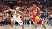 Nov 19, 2025; Chicago, Illinois, USA; Alabama Crimson Tide guard Aden Holloway (2) drives to the basket against Illinois Fighting Illini guard Kylan Boswell (4) during the second half at United Center. Mandatory Credit: Kamil Krzaczynski-Imagn Images