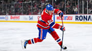 Dec 3, 2024; Montreal, Quebec, CAN; Montreal Canadiens right wing Patrik Laine (92) shoots the puck against the New York Islanders during the first period at Bell Centre. Mandatory Credit: David Kirouac-Imagn Images