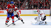 Apr 27, 2025; Montreal, Quebec, CAN; Washington Capitals goalie Logan Thompson (48) makes a save against Montreal Canadiens center Alex Newhook (15) during the third period in game four of the first round of the 2025 Stanley Cup Playoffs at Bell Centre. Mandatory Credit: David Kirouac-Imagn Images