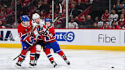 Apr 27, 2025; Montreal, Quebec, CAN; Montreal Canadiens right wing Cole Caufield (13) and defenseman Lane Hutson (48)defend against Washington Capitals left wing Anthony Beauvillier (72) during the second period in game four of the first round of the 2025 Stanley Cup Playoffs at Bell Centre. Mandatory Credit: David Kirouac-Imagn Images