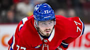 Feb 8, 2025; Montreal, Quebec, CAN; Montreal Canadiens center Kirby Dach (77) waits for a face-off against the New Jersey Devils during the second period at Bell Centre. Mandatory Credit: David Kirouac-Imagn Images