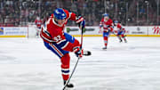 Mar 22, 2025; Montreal, Quebec, CAN; Montreal Canadiens right wing Patrik Laine (92) shoots the puck against the Colorado Avalanche in the first period at Bell Centre. Mandatory Credit: David Kirouac-Imagn Images