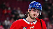 Jan 28, 2025; Montreal, Quebec, CAN; Montreal Canadiens center Kirby Dach (77) looks on during warm-up before the game against the Winnipeg Jets at Bell Centre. Mandatory Credit: David Kirouac-Imagn Images