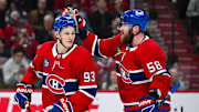Apr 14, 2025; Montreal, Quebec, CAN; Montreal Canadiens defenseman David Savard (58) congratulates right wing Ivan Demidov (93) after his first career NHL goal against the Chicago Blackhawks in the first period at Bell Centre. Mandatory Credit: David Kirouac-Imagn Images