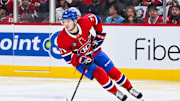 Apr 27, 2025; Montreal, Quebec, CAN; Montreal Canadiens center Jake Evans (71) plays the puck against the Washington Capitals during the second period in game four of the first round of the 2025 Stanley Cup Playoffs at Bell Centre. Mandatory Credit: David Kirouac-Imagn Images