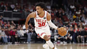 Nov 4, 2025; Chicago, Illinois, USA; Chicago Bulls guard Tre Jones (30) drives to the basket against the Philadelphia 76ers during the first half at United Center. Mandatory Credit: Kamil Krzaczynski-Imagn Images