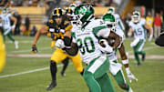 Jun 16, 2024; Hamilton, Ontario, CAN; Saskatchewan Rough Riders wide receiver Ajou Ajou (80) carries the ball in the fourth quarter against the Hamilton Tiger Cats at Tim Hortons Field. Mandatory Credit: Gerry Angus-Imagn Images