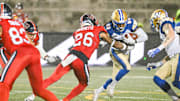 Jul 1, 2023; Montreal, Quebec, CAN; Montreal Alouettes linebacker Tyrice Beverette (26) tackles Winnipeg Blue Bombers wide receiver Janarion Grant (80) during the fourth quarter at Percival Molson Memorial Stadium. Mandatory Credit: David Kirouac-Imagn Images