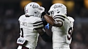 Mississippi State Bulldogs cornerback Kelley Jones (1) and safety Tony Mitchell (9) celebrate a stop on fourth and one in the second quarter against the Texas A&M Aggies at Kyle Field.
