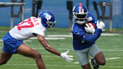 New York Giants wide receiver Montrell Washington (left), is trying to make the 53-man roster.