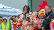 Rowdy Rooster lurks in the background as Kansas City Chiefs running back and Vineland High School alum Isiah Pacheco speaks during a parade in his honor last year.