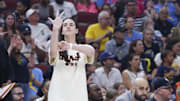 Jul 27, 2025; Chicago, Illinois, USA; Injured Indiana Fever guard Caitlin Clark (22) reacts during the first half of a basketball game against the Chicago Sky at United Center. Mandatory Credit: Kamil Krzaczynski-Imagn Images