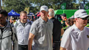 Nov 22, 2025; Orlando, Florida, USA; UCF Knights head coach Scott Frost walks into the venue before the game against the Oklahoma State Cowboys at Acrisure Bounce House. Mandatory Credit: Mike Watters-Imagn Images