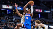 Oct 11, 2025; Indianapolis, Indiana, USA; Oklahoma City Thunder forward Ousmane Dieng (13) shoots the ball while Indiana Pacers forward Jalen Slawson (18) defends in the second half at Gainbridge Fieldhouse. Mandatory Credit: Trevor Ruszkowski-Imagn Images