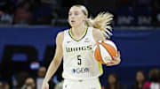 Jul 9, 2025; Chicago, Illinois, USA; Dallas Wings guard Paige Bueckers (5) brings the ball up court against the Chicago Sky during the first half at Wintrust Arena. Mandatory Credit: Kamil Krzaczynski-Imagn Images