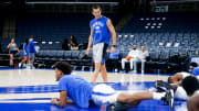 Darby Rich, the Memphis strength and conditioning coach, leads the men   s basketball team in stretching before the preseason game against Lane College at FedExForum in Memphis, Tenn., on Sunday, October 29, 2023.