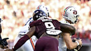 Sep 27, 2025; College Station, Texas, USA; Texas A&M Aggies defensive end Cashius Howell (9) sacks Auburn Tigers quarterback Jackson Arnold (11) in the second half at Kyle Field. Mandatory Credit: Maria Lysaker-Imagn Images