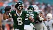 Dec 8, 2024; Miami Gardens, Florida, USA; New York Jets quarterback Aaron Rodgers (8) attempts a pass against the Miami Dolphins during the second half at Hard Rock Stadium. Mandatory Credit: Jasen Vinlove-Imagn Images