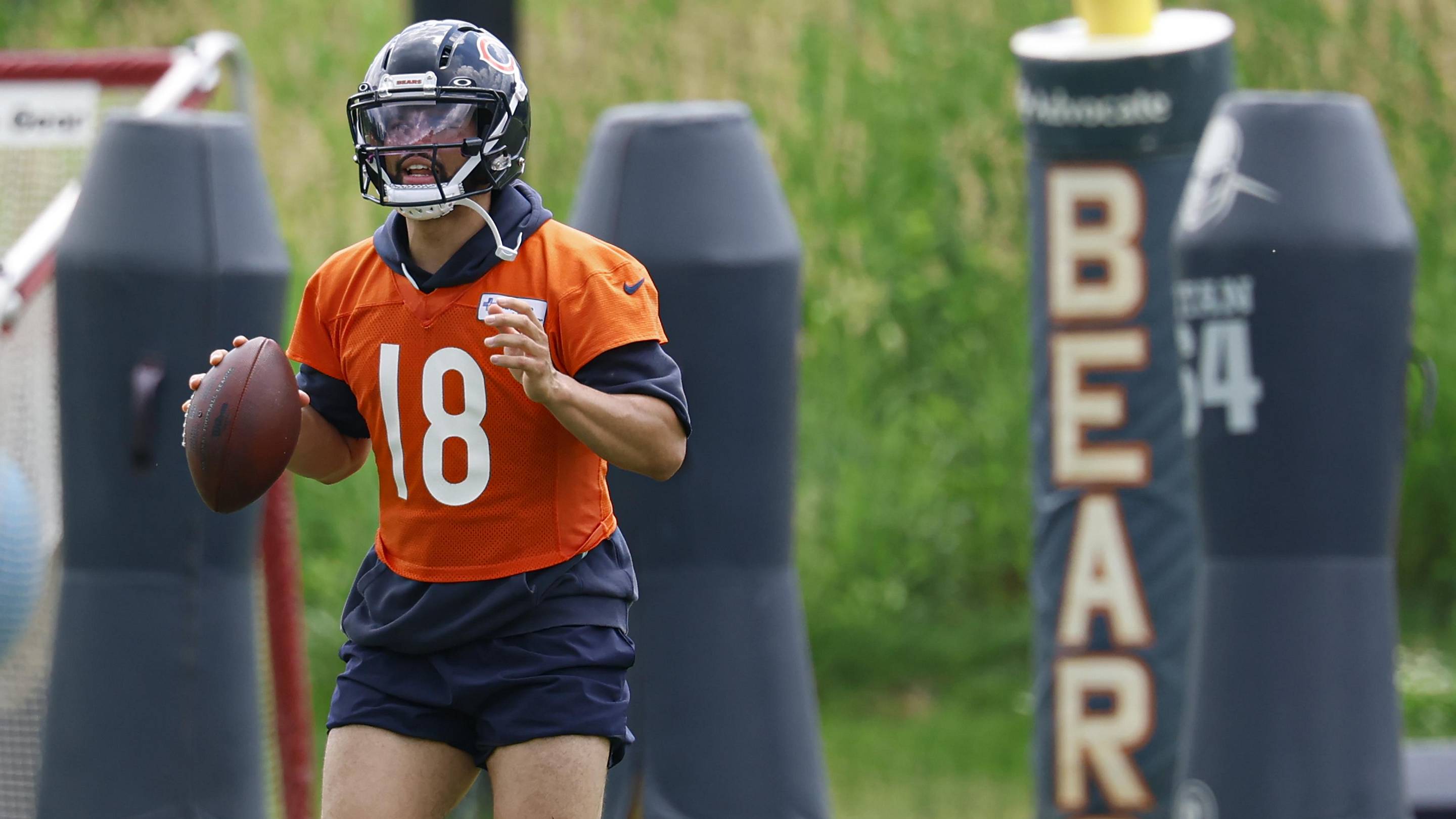 Caleb Williams looks upfield during minicamp passing drills.