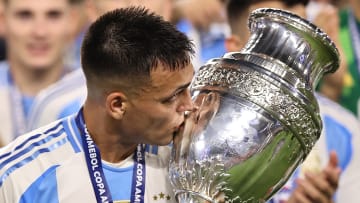 Lautaro Martinez with the Copa America trophy after scoring the game-winning goal against Colombia