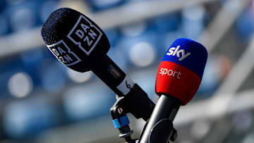 A couple of microphones branded DAZN and Sky Sport are seen...
