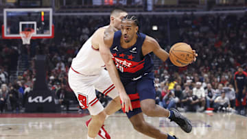 Jan 10, 2025; Chicago, Illinois, USA; Washington Wizards forward Alexandre Sarr (20) drives to the basket against Chicago Bulls center Nikola Vucevic (9) during the second half at United Center. Mandatory Credit: Kamil Krzaczynski-Imagn Images