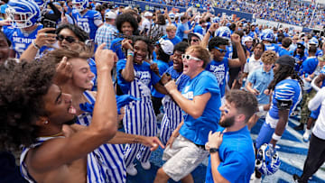 Memphis fans stormed the field celebrate after the Tigers defeated Arkansas 32-31.