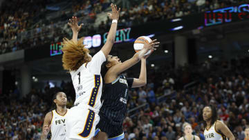 Jun 23, 2024; Chicago, Illinois, USA; Chicago Sky forward Angel Reese (5) goes to the basket against Indiana Fever forward NaLyssa Smith (1) during the second half of a basketball game at Wintrust Arena. Mandatory Credit: Kamil Krzaczynski-USA TODAY Sports