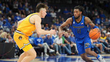 Memphis' Tyrese Hunter (11) drives to the basket as Missouri's Caleb Grill (31) defends him during the game between the University of Memphis and Missouri at FedExForum in Memphis, Tenn., on Monday, November 4, 2024.