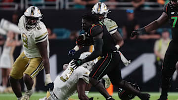 Oct 7, 2023; Miami Gardens, Florida, USA; Miami Hurricanes running back Donald Chaney Jr. (2) runs the ball against the Georgia Tech Yellow Jackets in the second half at Hard Rock Stadium. Mandatory Credit: Jasen Vinlove-Imagn Images