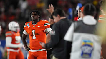 Dec 28, 2024; Orlando, FL, USA; Miami Hurricanes quarterback Cam Ward (1) looks up at the scoreboard during the second half against the Iowa State Cyclones at Camping World Stadium. Mandatory Credit: Jasen Vinlove-Imagn Images