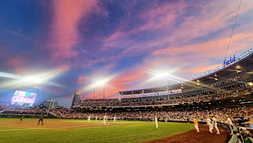 A cotton candy sky is seen well during game one of the NCAA College World Series at Charles Schwab Field in Omaha, Neb.