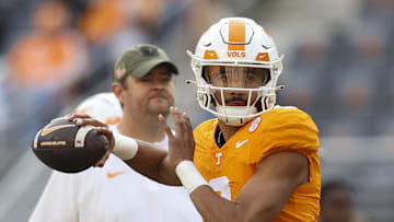 Nov 25, 2023; Knoxville, Tennessee, USA; Tennessee Volunteers quarterback Nico Iamaleava (8) warms up as head coach Josh Heupel looks on before the game against the Vanderbilt Commodores at Neyland Stadium. Mandatory Credit: Randy Sartin-Imagn Images