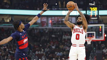 Jan 10, 2025; Chicago, Illinois, USA; Chicago Bulls guard Coby White (0) shoots