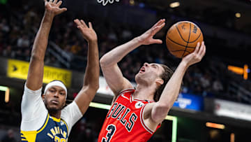 Mar 2, 2025; Indianapolis, Indiana, USA; Chicago Bulls guard Josh Giddey (3)  shoots the ball while Indiana Pacers center Myles Turner (33) defends in the first half at Gainbridge Fieldhouse. Mandatory Credit: Trevor Ruszkowski-Imagn Images