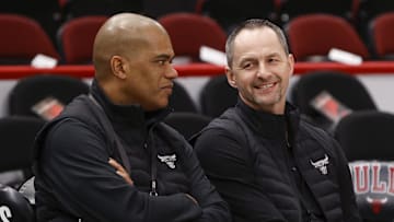 Apr 22, 2022; Chicago, Illinois, USA; Chicago Bulls executive vice president of basketball operations Arturas Karnisovas (right) talks with general manager Marc Eversley (left) before game three of the first round for the 2022 NBA playoffs against the Milwaukee Bucks at United Center. Mandatory Credit: Kamil Krzaczynski-Imagn Images