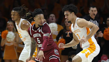 Mar 8, 2025; Knoxville, Tennessee, USA; South Carolina Gamecocks guard Jamarii Thomas (6) moves the ball against Tennessee Volunteers guard Bishop Boswell (3) during the first half at Thompson-Boling Arena at Food City Center. Mandatory Credit: Randy Sartin-Imagn Images