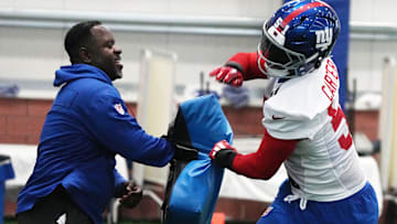 Eat Rutherford, NJ -- May 9, 2025 -- Inside linebacker coach John Egorugwu and Abdul Carter during practice at Giants Rookie Minicamp.